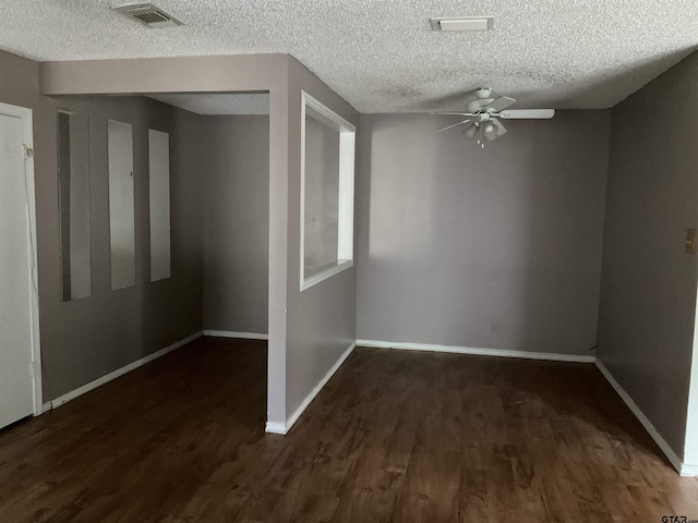 8307 Garrett Dr, Tyler, TX 75703 - spare room featuring ceiling fan, wood finished floors, and a textured ceiling