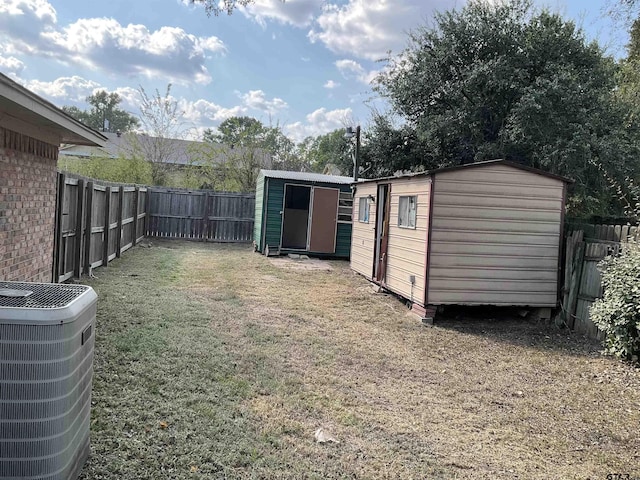 8307 Garrett Dr, Tyler, TX 75703 - fenced backyard featuring a storage unit