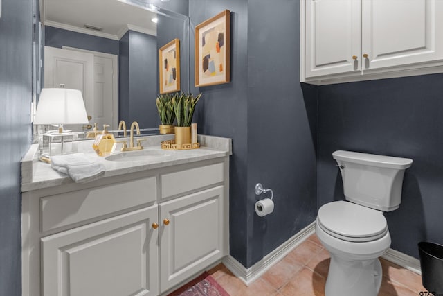 bathroom featuring toilet, vanity, tile patterned floors, and crown molding