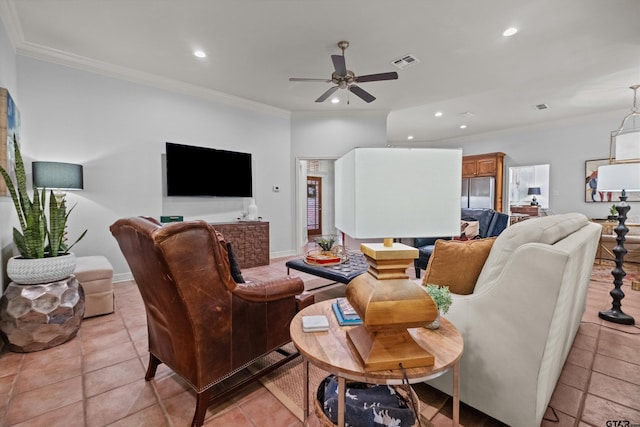 living room with ceiling fan, ornamental molding, and light tile patterned floors