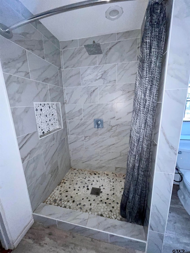 bathroom with a shower with shower curtain