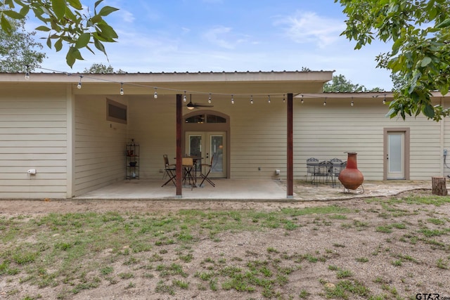 rear view of property featuring a patio area and french doors