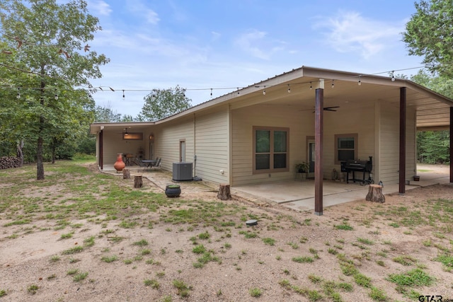 rear view of house featuring cooling unit, ceiling fan, and a patio