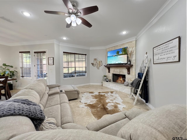 living room featuring crown molding, a wealth of natural light, and a fireplace