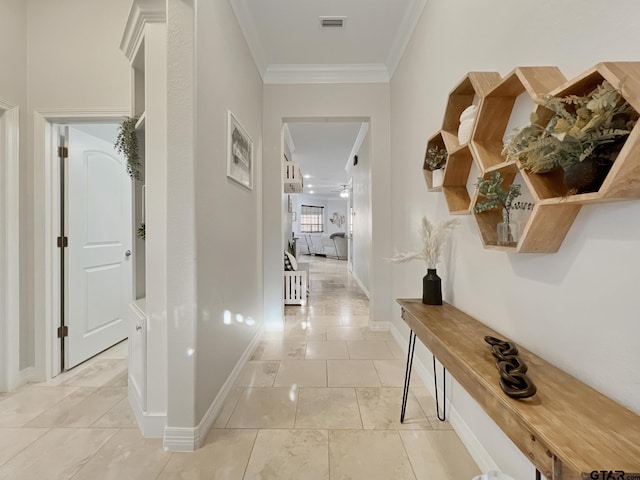 corridor with crown molding and light tile patterned floors