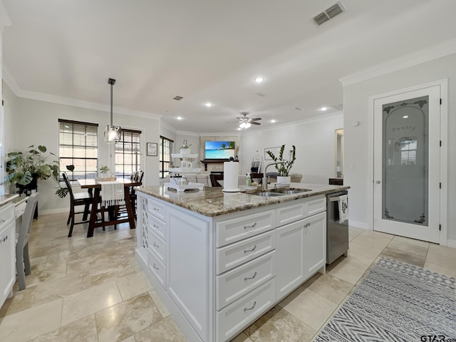 kitchen featuring stone countertops, stainless steel dishwasher, pendant lighting, a kitchen island with sink, and white cabinets