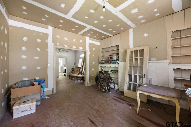 502 E Montgomery St, Crockett, TX 75835 - miscellaneous room with wood finished floors, a ceiling fan, and a high ceiling