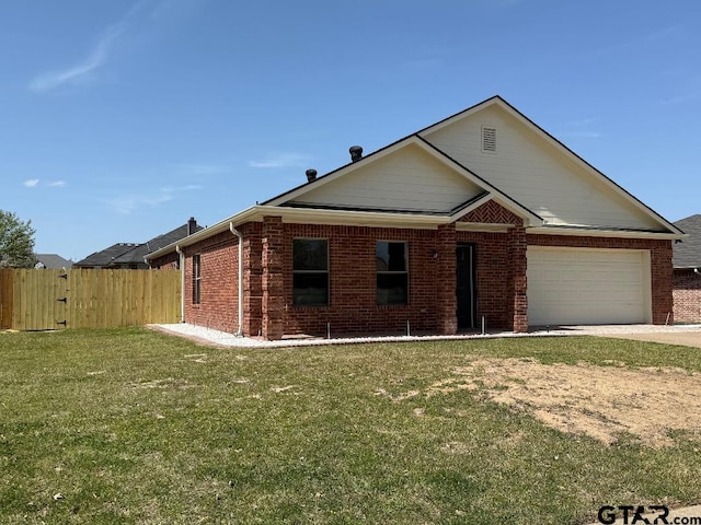 553 Princess Pl, Tyler, TX 75704 - view of front facade with a garage, fence, concrete driveway, brick siding, and a front lawn