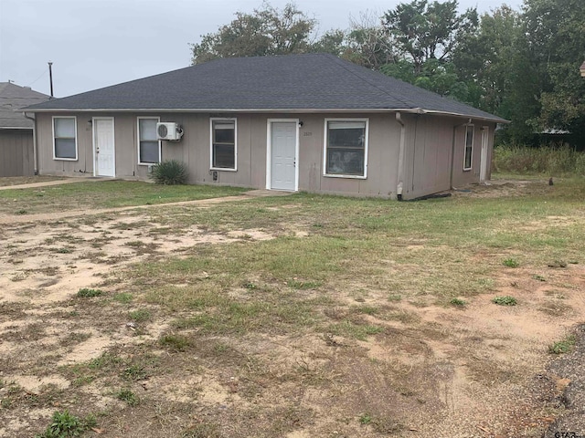 ranch-style house with a front yard