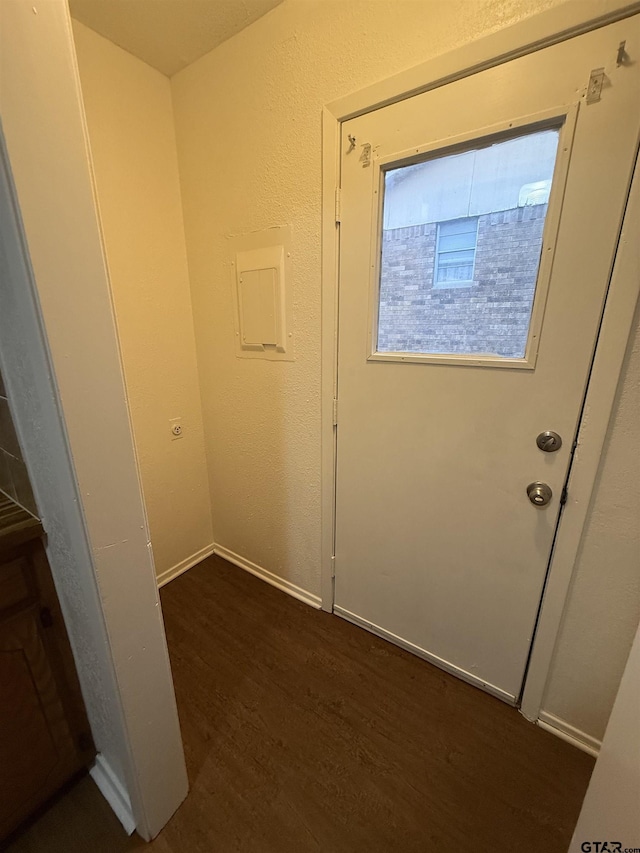 doorway to outside with dark hardwood / wood-style floors