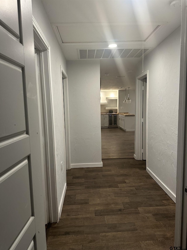 corridor with dark wood-type flooring