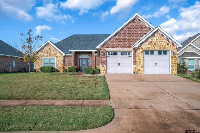 view of front facade featuring central AC, a front lawn, and a garage