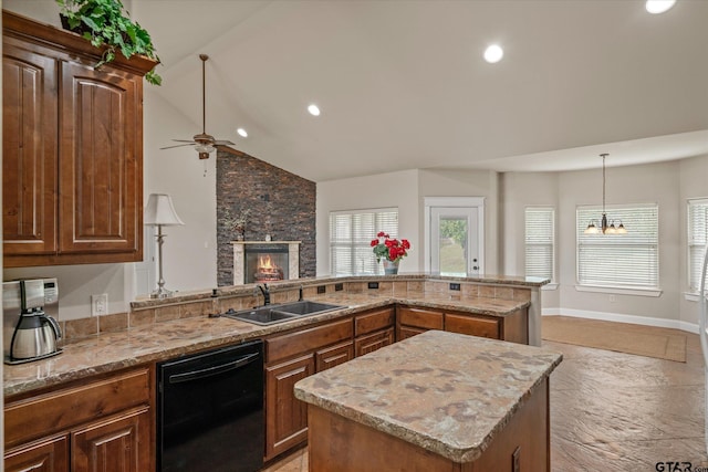 kitchen with lofted ceiling, ceiling fan with notable chandelier, sink, black dishwasher, and a kitchen island