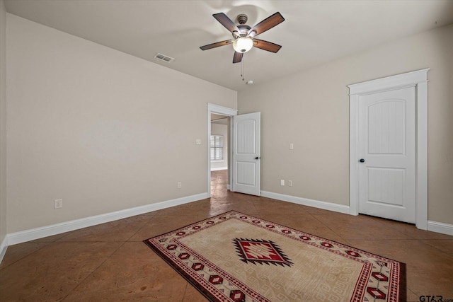 unfurnished bedroom featuring tile patterned flooring and ceiling fan