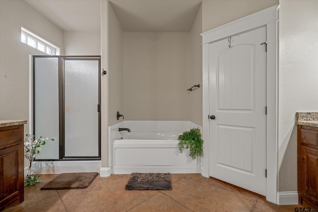 bathroom with vanity, tile patterned floors, and independent shower and bath