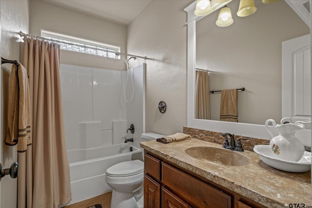 full bathroom with vanity, toilet, and shower / bath combo with shower curtain