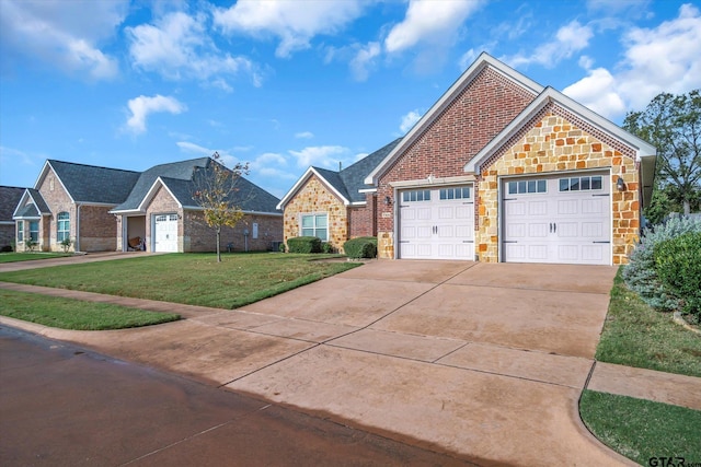 view of front of house with a front yard and a garage