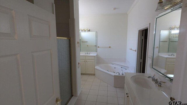 1173 Garden Park Cir, Tyler, TX 75703 - full bath featuring tile patterned flooring, a bath, two vanities, and a shower stall