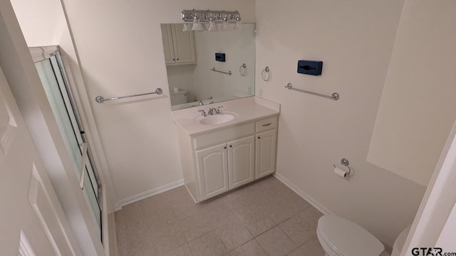 1173 Garden Park Cir, Tyler, TX 75703 - bathroom featuring toilet, vanity, and baseboards
