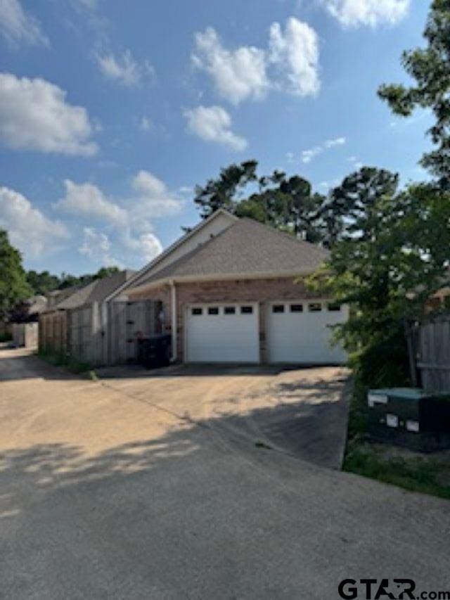 1173 Garden Park Cir, Tyler, TX 75703 - view of front of home featuring driveway and an attached garage