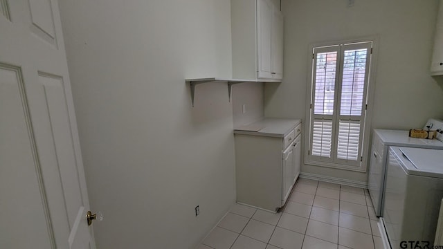 1173 Garden Park Cir, Tyler, TX 75703 - laundry room with washer and dryer, cabinet space, light tile patterned floors, and baseboards