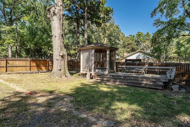 view of yard with a deck and a gazebo