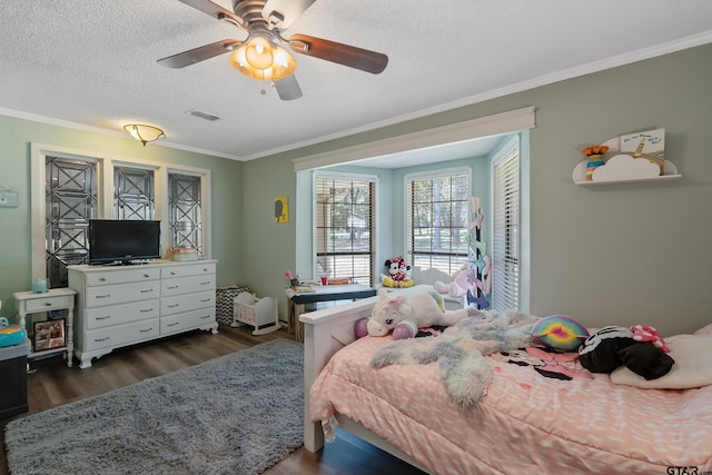 bedroom featuring ceiling fan, a textured ceiling, dark hardwood / wood-style flooring, and ornamental molding