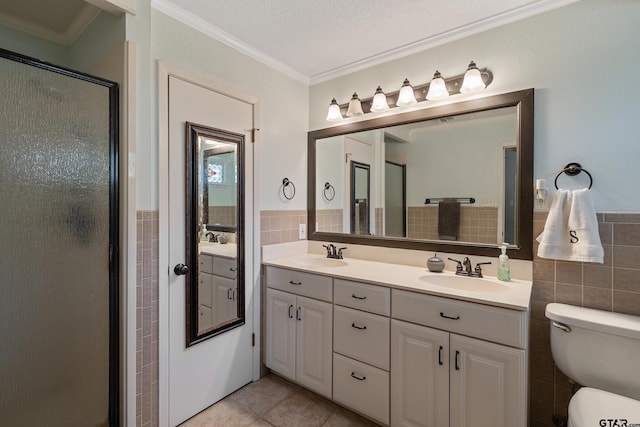 bathroom featuring a shower with door, ornamental molding, a textured ceiling, tile patterned floors, and tile walls