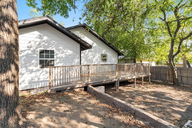 view of side of property featuring a deck