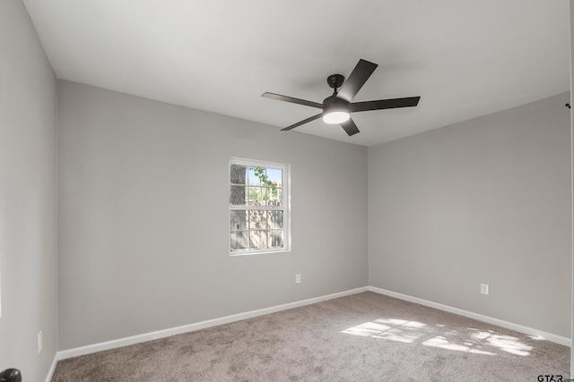 unfurnished room with ceiling fan and carpet floors