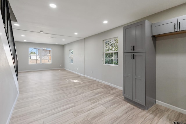 spare room featuring light wood-type flooring