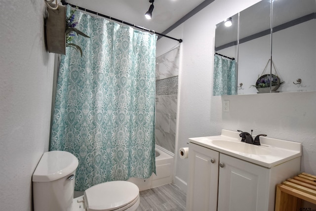 full bath with a textured wall, toilet, shower / bath combo, vanity, and wood finished floors