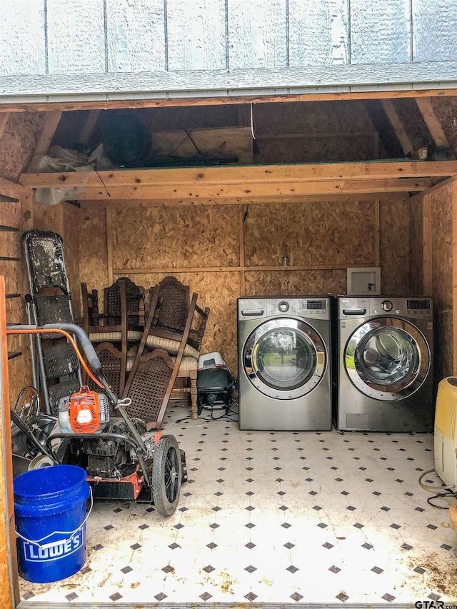 clothes washing area featuring laundry area, independent washer and dryer, and tile patterned floors