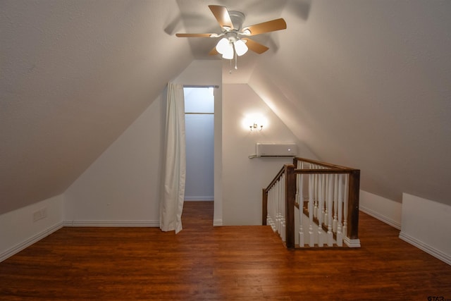 additional living space featuring lofted ceiling, wood finished floors, and baseboards