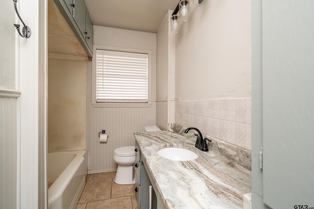 311 S Houston St, Bullard, TX 75757 - full bathroom with tile patterned floors, vanity, toilet, and tub / shower combination