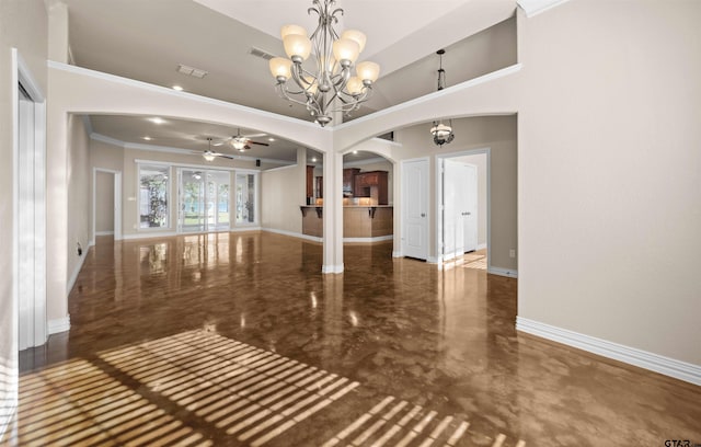 empty room with ceiling fan with notable chandelier and crown molding