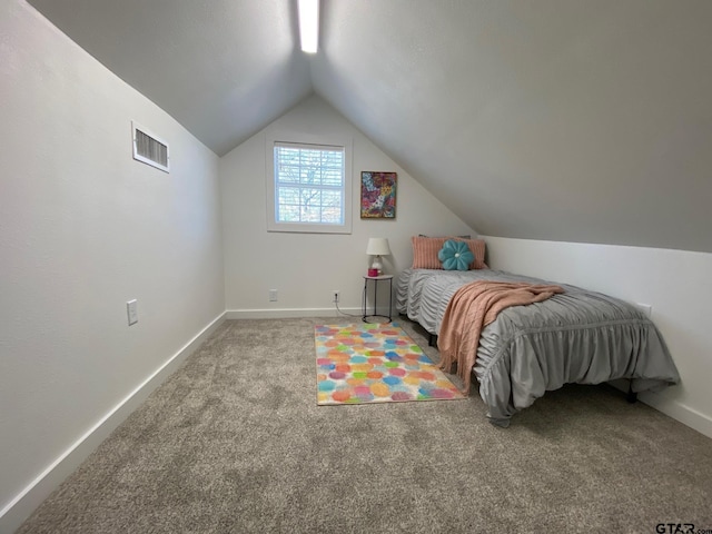 bedroom featuring vaulted ceiling, carpet flooring, baseboards, and visible vents