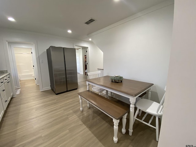 dining room with visible vents, recessed lighting, light wood-style floors, and ornamental molding