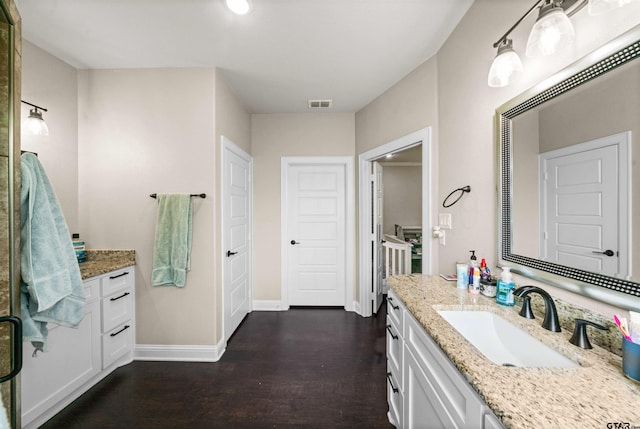 bathroom featuring vanity and hardwood / wood-style flooring