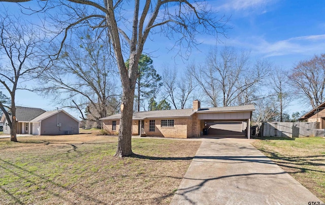 ranch-style house featuring a front lawn and a carport