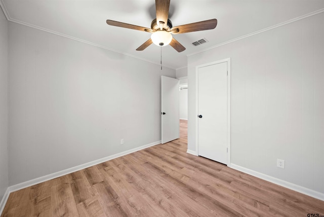 unfurnished bedroom featuring ceiling fan, ornamental molding, and light hardwood / wood-style floors