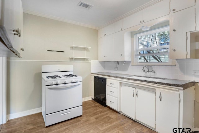 kitchen with white cabinets, white gas stove, visible vents, and dishwasher