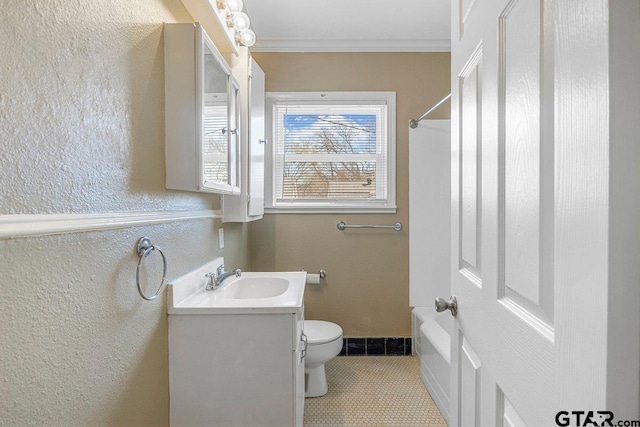 bathroom featuring crown molding, a textured wall, toilet, vanity, and tile patterned floors