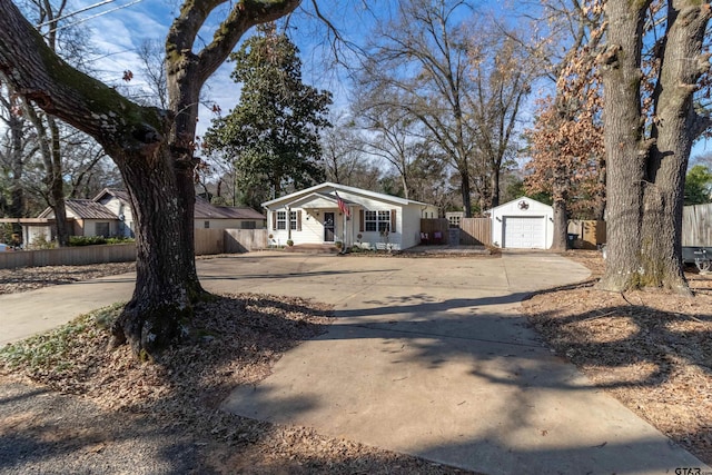 ranch-style home with an outbuilding and a garage