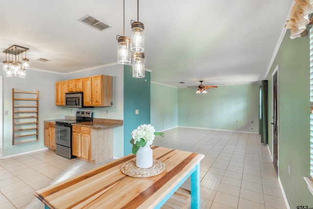 kitchen with ornamental molding, appliances with stainless steel finishes, hanging light fixtures, and light tile patterned floors