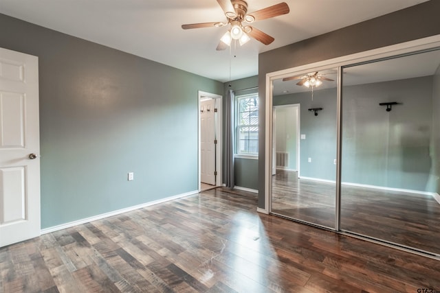 unfurnished bedroom featuring wood-type flooring, a closet, and ceiling fan