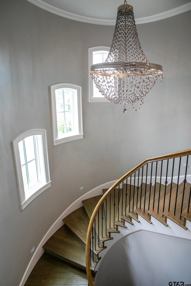 staircase featuring ornamental molding