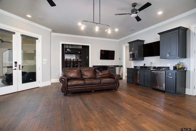 living room with french doors, crown molding, dark hardwood / wood-style flooring, sink, and ceiling fan