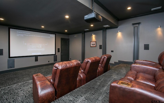 carpeted cinema room featuring ornate columns