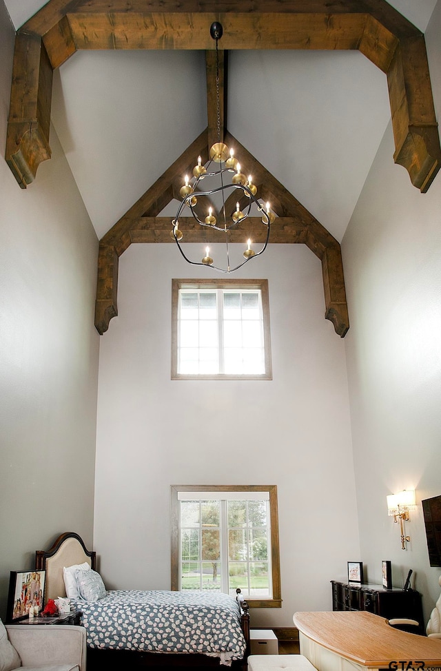 bedroom with high vaulted ceiling, a chandelier, and beam ceiling